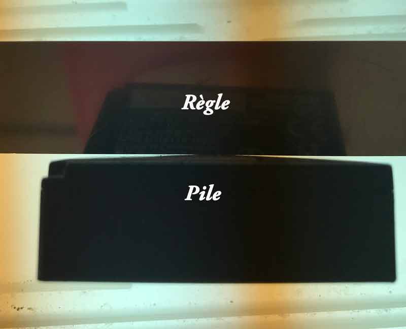 Profil d'une pile NP-W126S gonflée en contre-jour comparée à une règle.